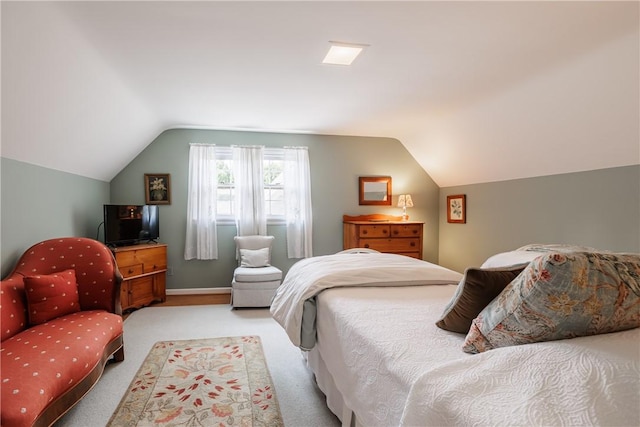 307 Allens Creek Rd, Brighton, NY 14618 - bedroom featuring vaulted ceiling, light carpet, and baseboards
