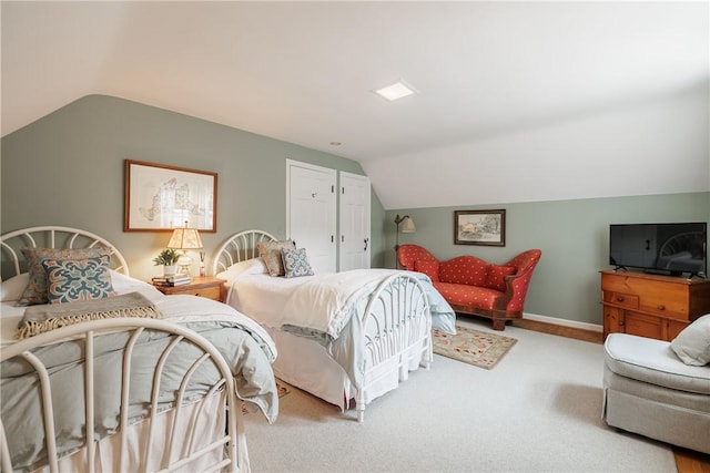 307 Allens Creek Rd, Brighton, NY 14618 - carpeted bedroom featuring vaulted ceiling and baseboards