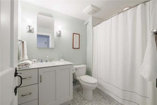 307 Allens Creek Rd, Brighton, NY 14618 - bathroom featuring vanity, toilet, and tile patterned floors