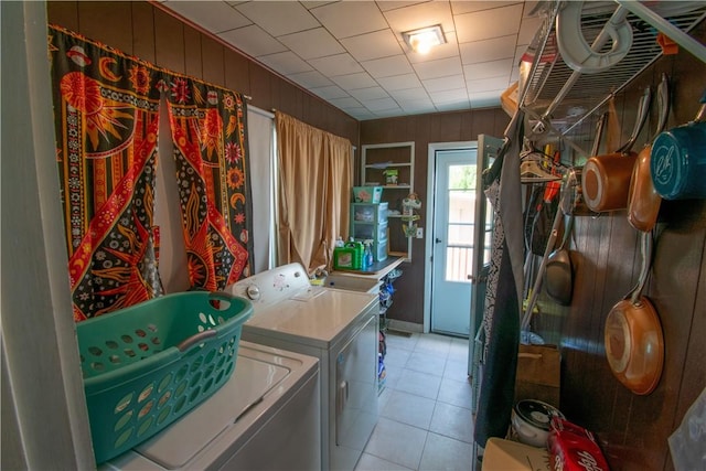 249 Glasgow St, Galen, NY 14433 - laundry area featuring separate washer and dryer, light tile patterned flooring, and wooden walls