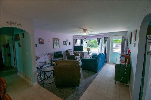249 Glasgow St, Galen, NY 14433 - living room with arched walkways, ceiling fan, and light tile patterned floors