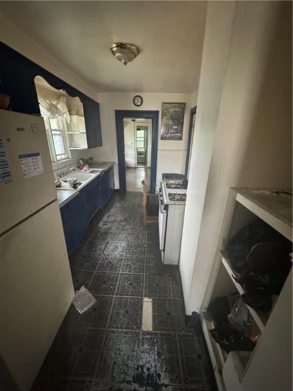 94 Lorimer St, Rochester, NY 14608 - kitchen featuring white appliances, dark flooring, and light countertops