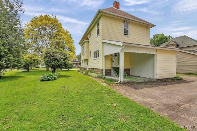 65 E Main St, Arcade, NY 14009 - back of property featuring entry steps, a chimney, and a yard