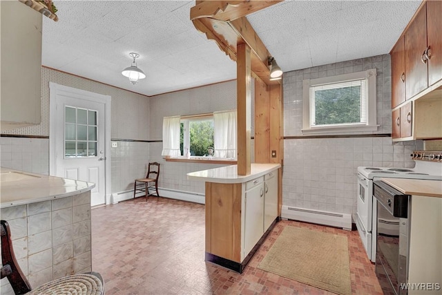 65 E Main St, Arcade, NY 14009 - kitchen with a baseboard radiator, a peninsula, tile walls, light countertops, and white range with electric stovetop