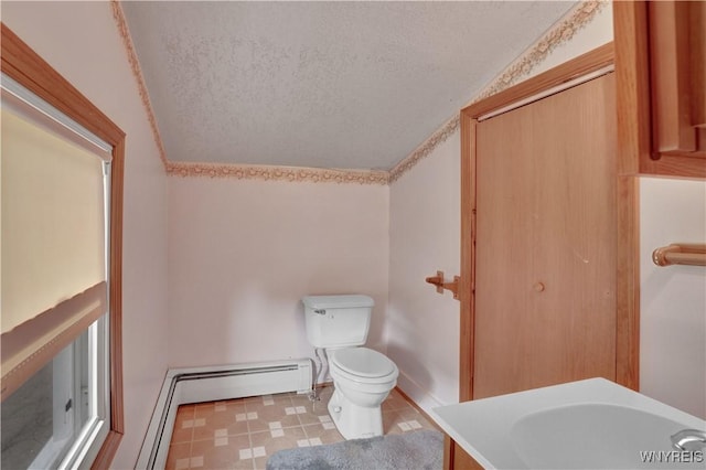 65 E Main St, Arcade, NY 14009 - bathroom featuring toilet, a textured ceiling, and vanity