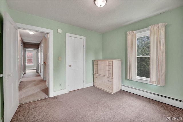 65 E Main St, Arcade, NY 14009 - unfurnished bedroom with baseboard heating, carpet floors, and baseboards
