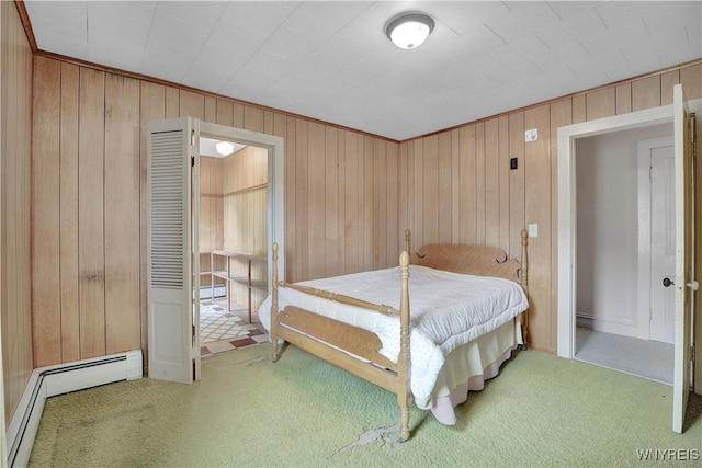 65 E Main St, Arcade, NY 14009 - carpeted bedroom featuring wooden walls and a baseboard radiator