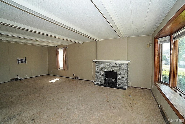 2927 S Ave, Niagara Falls, NY 14305 - unfurnished living room with beam ceiling and a stone fireplace
