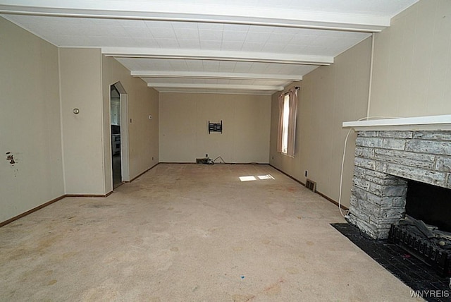 2927 S Ave, Niagara Falls, NY 14305 - unfurnished living room with light colored carpet, beamed ceiling, and a stone fireplace