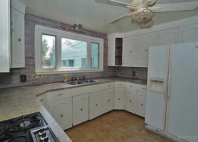 2927 S Ave, Niagara Falls, NY 14305 - kitchen with white fridge with ice dispenser, a sink, white cabinetry, and decorative backsplash