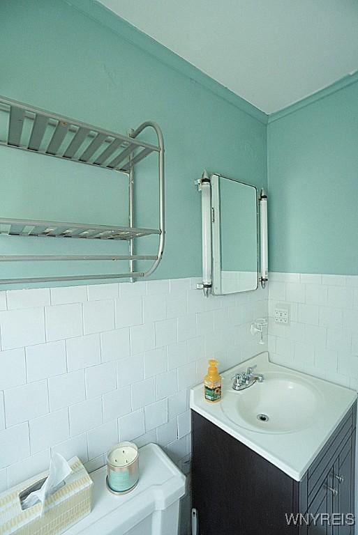 2927 S Ave, Niagara Falls, NY 14305 - bathroom with vanity, tile walls, and wainscoting