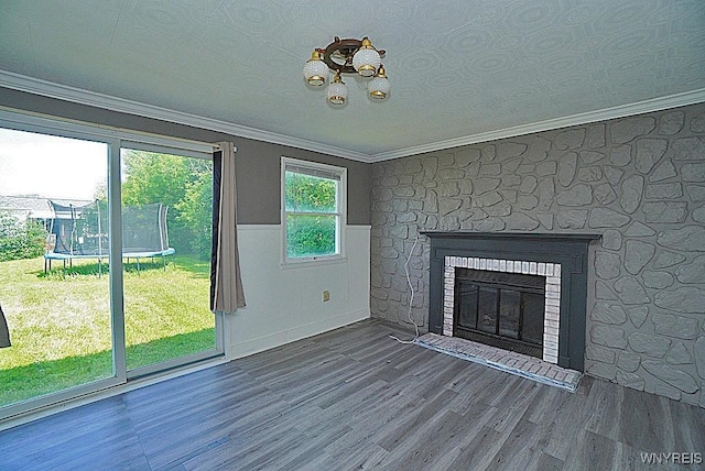 2927 S Ave, Niagara Falls, NY 14305 - unfurnished living room featuring ornamental molding, a wainscoted wall, wood finished floors, and a glass covered fireplace