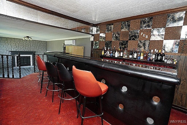 2927 S Ave, Niagara Falls, NY 14305 - indoor dry bar with crown molding and a stone fireplace