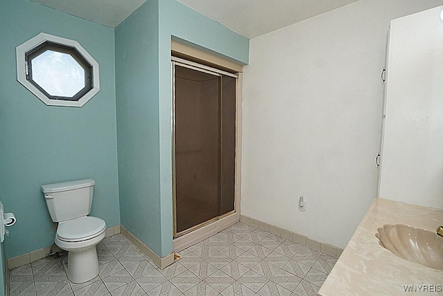 2927 S Ave, Niagara Falls, NY 14305 - bathroom featuring toilet, vanity, a stall shower, and baseboards