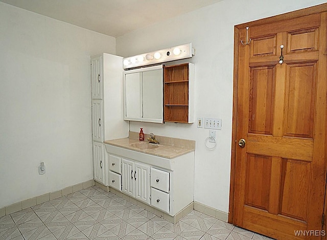 2927 S Ave, Niagara Falls, NY 14305 - bathroom with vanity and baseboards