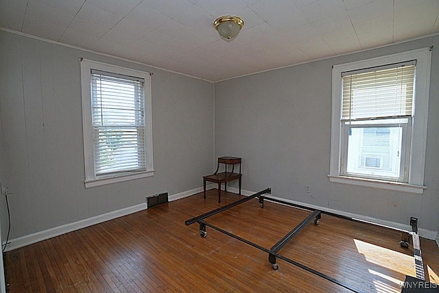 2927 S Ave, Niagara Falls, NY 14305 - unfurnished bedroom featuring hardwood / wood-style flooring and baseboards