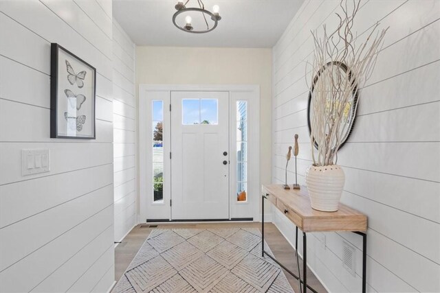 96 Chase Meadow Trl, Mendon, NY 14472 - foyer entrance with wood finished floors and a chandelier
