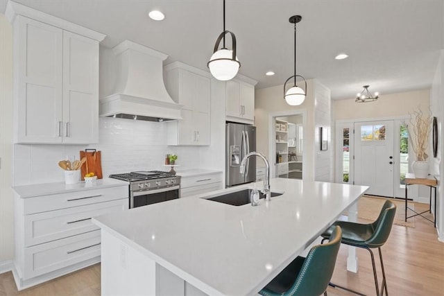 96 Chase Meadow Trl, Mendon, NY 14472 - kitchen with custom range hood, stainless steel appliances, a sink, white cabinetry, and light countertops