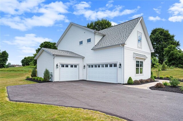 96 Chase Meadow Trl, Mendon, NY 14472 - view of home's exterior with driveway, an attached garage, roof with shingles, and a lawn