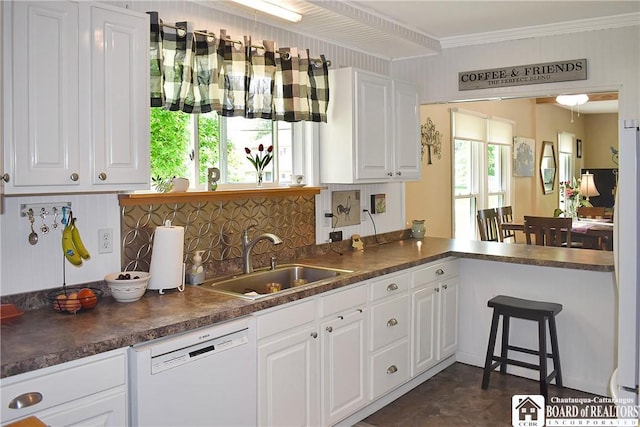 3938 S Ralph Ave, Ellery, NY 14712 - kitchen with dishwasher, a sink, dark countertops, white cabinets, and ornamental molding