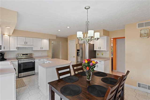 106 Shingle Landing Dr, Irondequoit, NY 14609 - dining area featuring a chandelier, light tile patterned flooring, recessed lighting, and baseboards