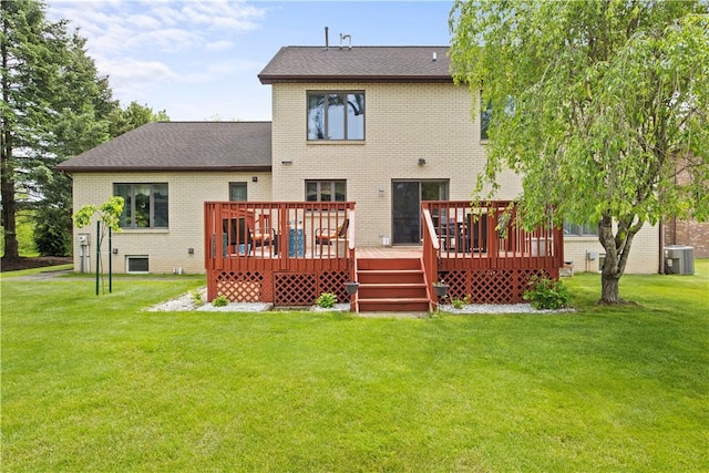 106 Shingle Landing Dr, Irondequoit, NY 14609 - back of house featuring brick siding, a lawn, a wooden deck, and central AC unit