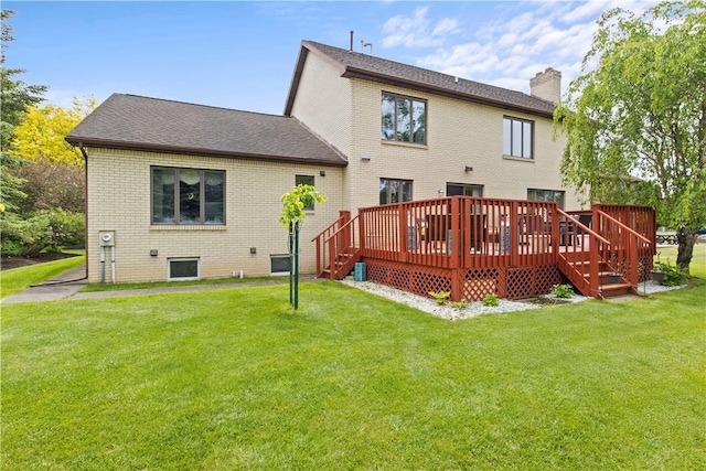 106 Shingle Landing Dr, Irondequoit, NY 14609 - rear view of house featuring a lawn, a chimney, brick siding, and a wooden deck