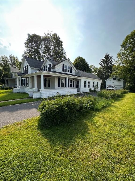 28 Payne St, Hamilton, NY 13346 - view of front of house featuring a front lawn and a porch