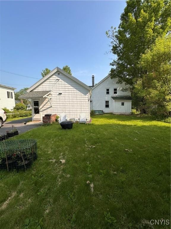 28 Payne St, Hamilton, NY 13346 - back of property featuring a lawn