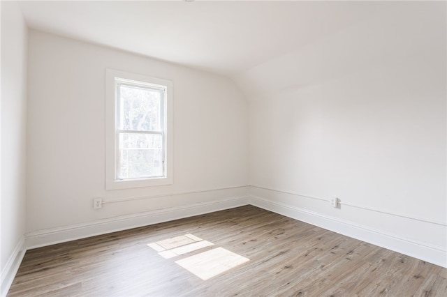 65 Hoff St, Rochester, NY 14621 - unfurnished room featuring wood finished floors, lofted ceiling, and baseboards