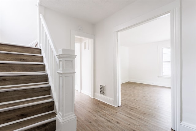 65 Hoff St, Rochester, NY 14621 - stairway with wood finished floors and baseboards