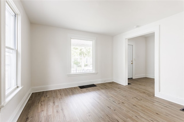 65 Hoff St, Rochester, NY 14621 - empty room with light wood-style flooring and baseboards