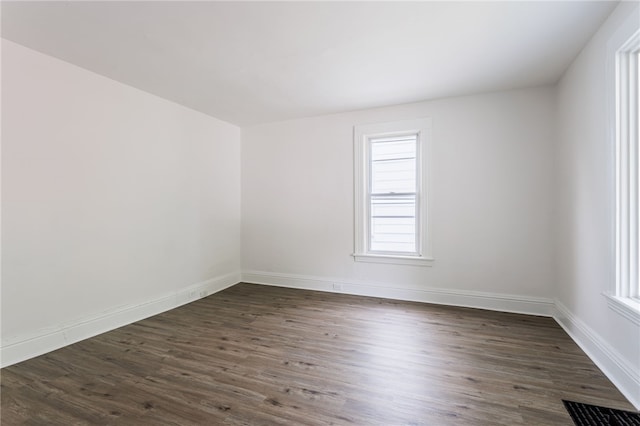 65 Hoff St, Rochester, NY 14621 - spare room featuring dark wood-type flooring and baseboards