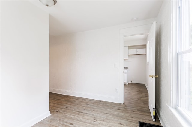 65 Hoff St, Rochester, NY 14621 - unfurnished room with light wood finished floors, baseboards, and plenty of natural light