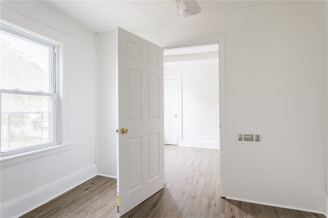 65 Hoff St, Rochester, NY 14621 - spare room featuring wood finished floors, baseboards, and a ceiling fan