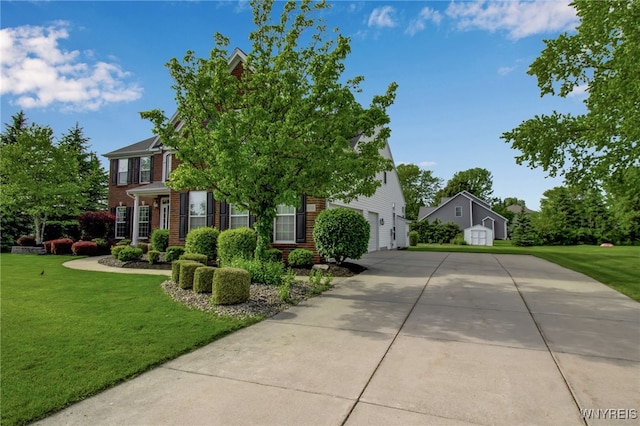 9100 Beech Meadow Ct, Clarence, NY 14032 - view of front of house featuring driveway, brick siding, and a front yard