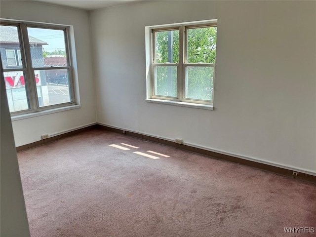 639 17th St, Niagara Falls, NY 14301 - empty room with plenty of natural light, carpet flooring, and baseboards