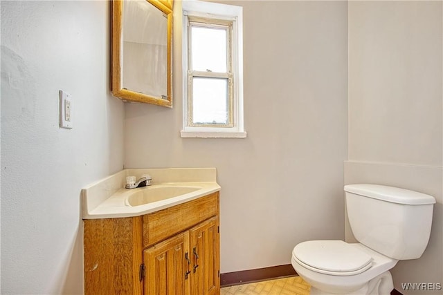 639 17th St, Niagara Falls, NY 14301 - half bathroom with toilet, baseboards, and vanity