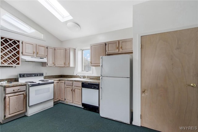 639 17th St, Niagara Falls, NY 14301 - kitchen with white appliances, under cabinet range hood, vaulted ceiling, light brown cabinets, and a skylight
