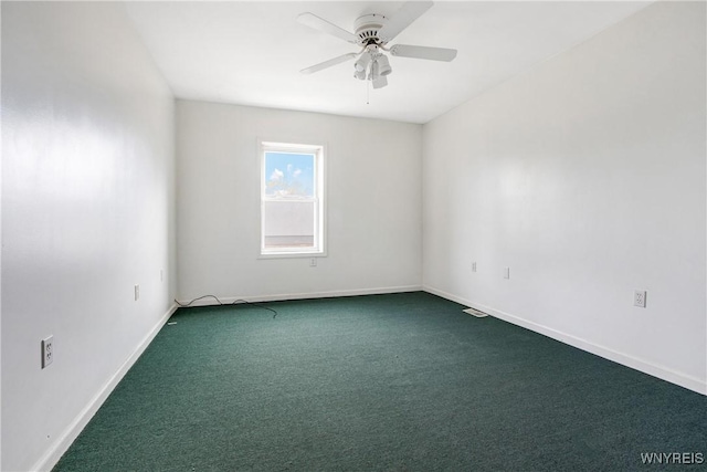 639 17th St, Niagara Falls, NY 14301 - empty room featuring dark colored carpet, a ceiling fan, and baseboards