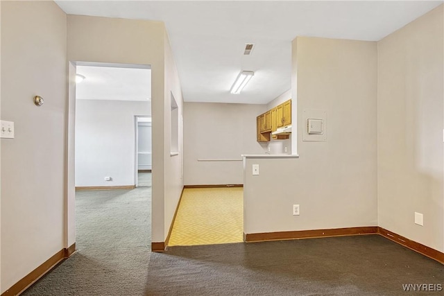 639 17th St, Niagara Falls, NY 14301 - spare room with dark carpet and baseboards