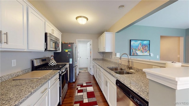 41 Brocton Dr, Lancaster, NY 14086 - kitchen with appliances with stainless steel finishes, a sink, white cabinets, dark wood-style floors, and light stone countertops