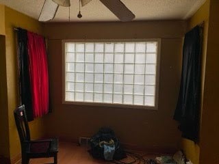 130 E Delavan Ave Unit N, Buffalo, NY 14208 - unfurnished room with a textured ceiling and ceiling fan