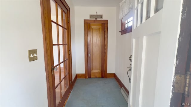 1324 Butternut St, Utica, NY 13502 - hall featuring light colored carpet, baseboard heating, and baseboards