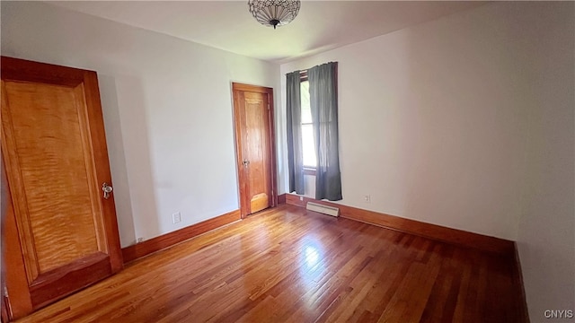 1324 Butternut St, Utica, NY 13502 - empty room featuring light wood-style flooring and baseboards