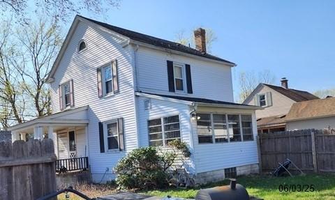 46 Kirby St, Bainbridge, NY 13733 - rear view of property with a chimney