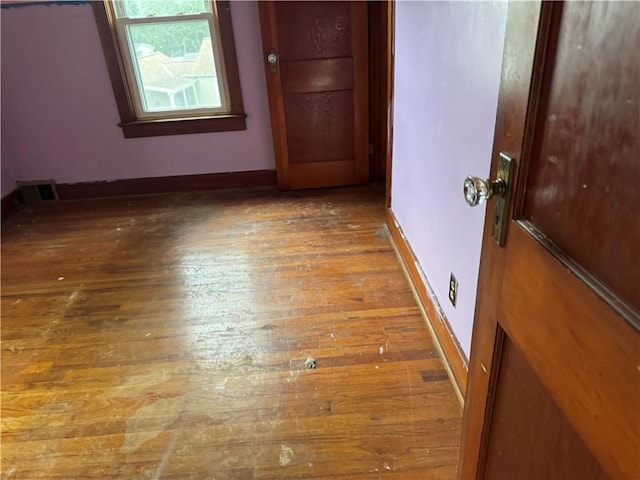 46 Kirby St, Bainbridge, NY 13733 - unfurnished room with wood-type flooring and baseboards