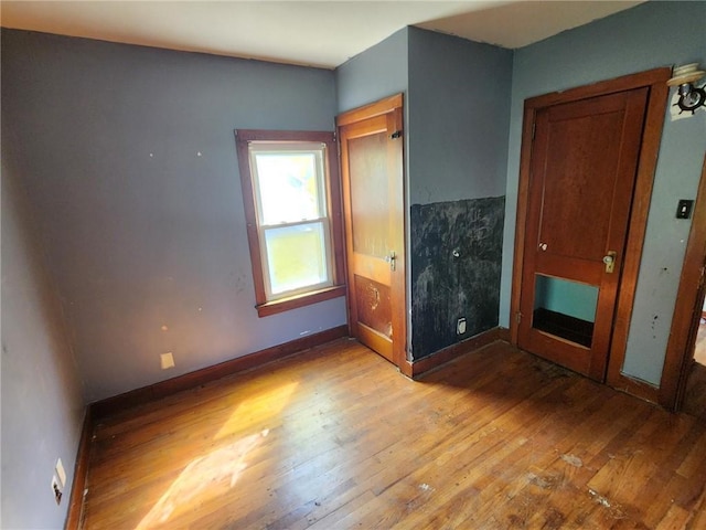 46 Kirby St, Bainbridge, NY 13733 - unfurnished bedroom with wood finished floors and baseboards