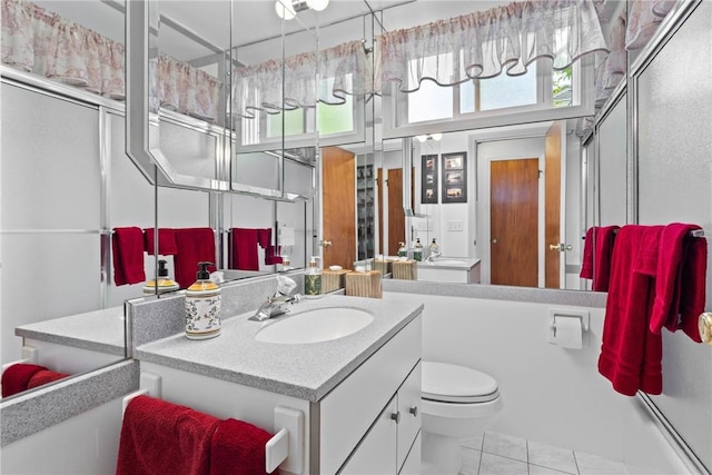 529 Backus Rd, Webster, NY 14580 - bathroom with toilet, vanity, and a shower with shower door