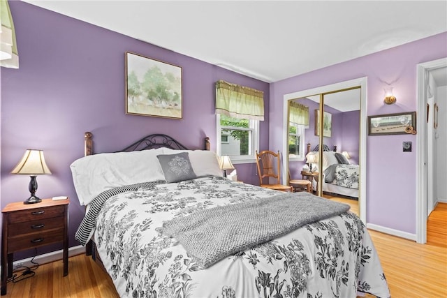 529 Backus Rd, Webster, NY 14580 - bedroom featuring a closet, wood finished floors, and baseboards
